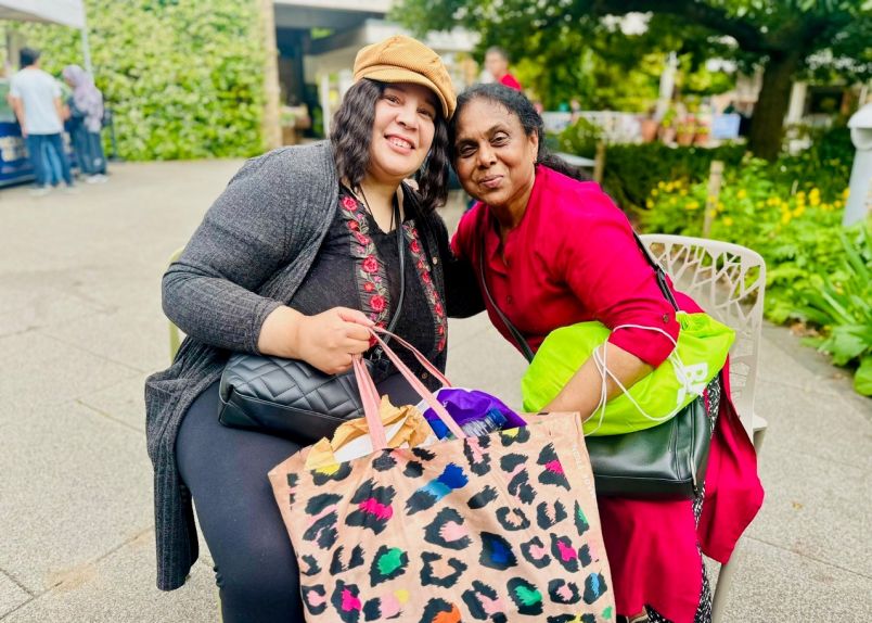 Adult daughter helping her mother in a wheelchair